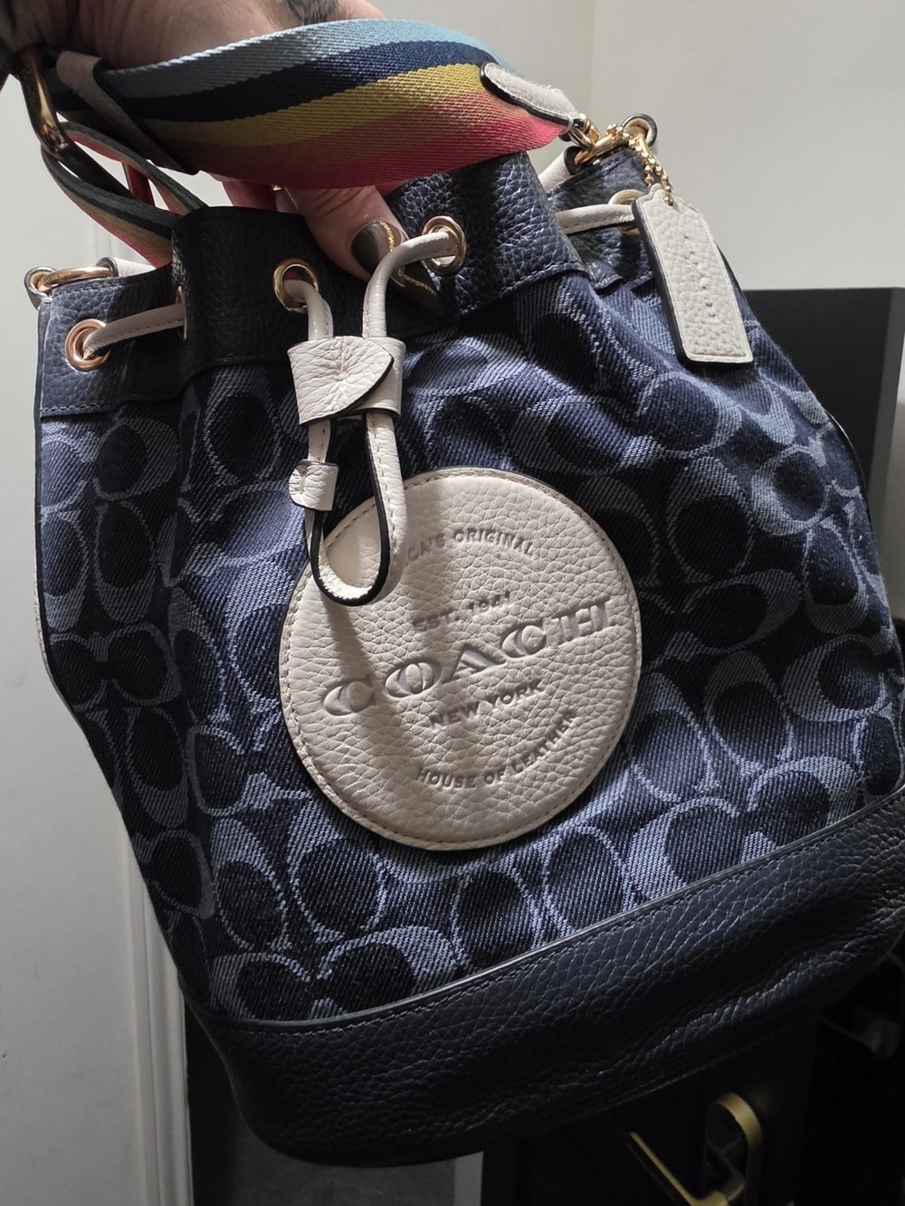 Coach Navy Signature Drawstring Bucket Bag with White Trim and Rainbow Strap